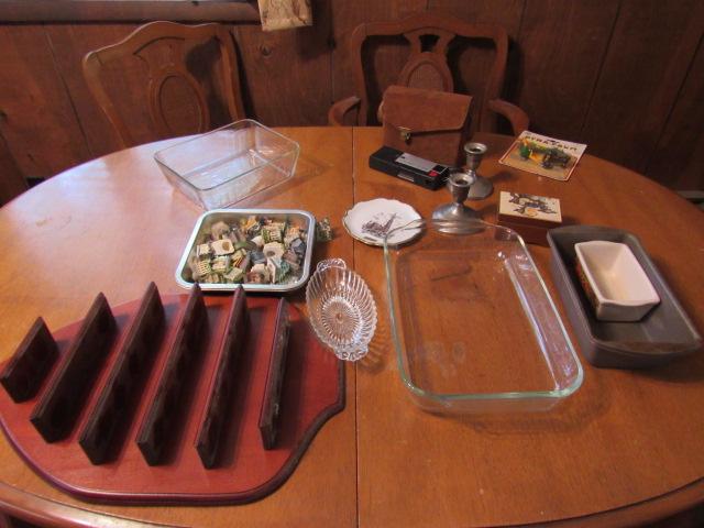 Pyrex dishes, nicknack shelf, building figurines, candle holders, camera and miscellaneous