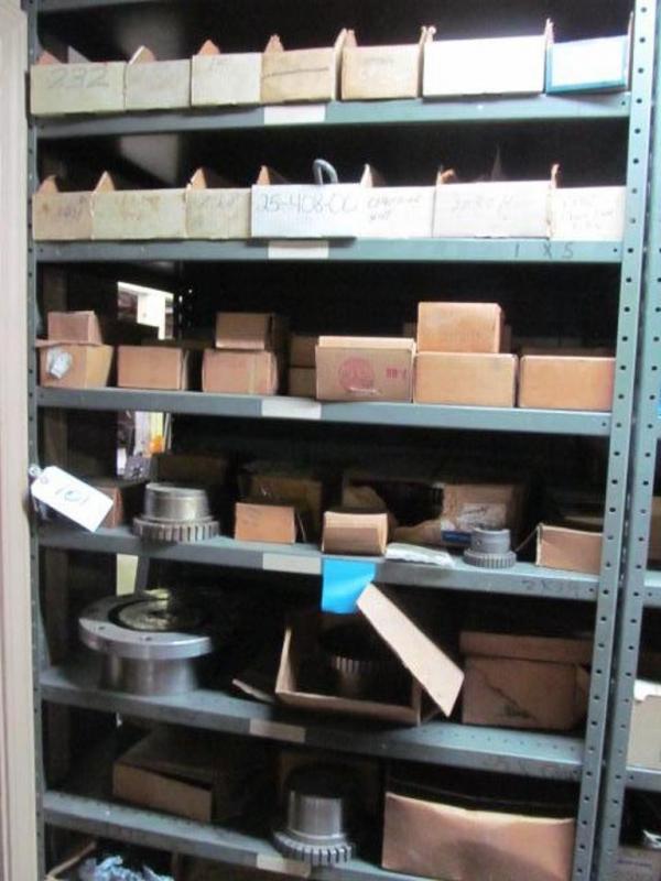 Shelf and contents consisting of bushings, gears, and other hardware