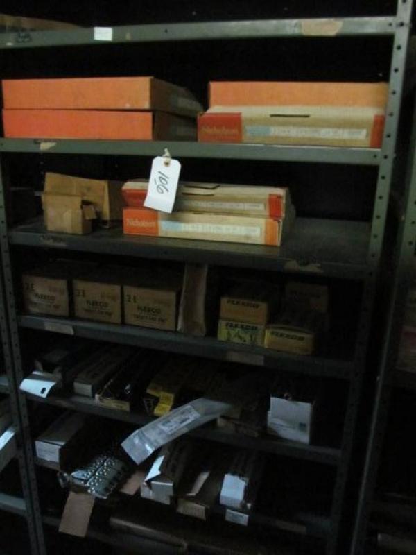 Shelf and contents; bandsaw blade, belt lacing, etc.