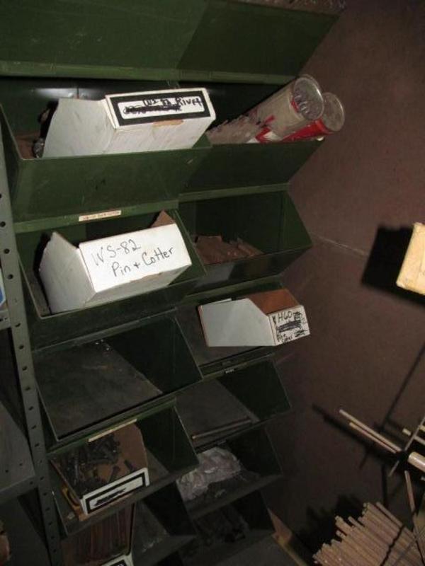Two stacks of storage bins and contents; welding rods etc.