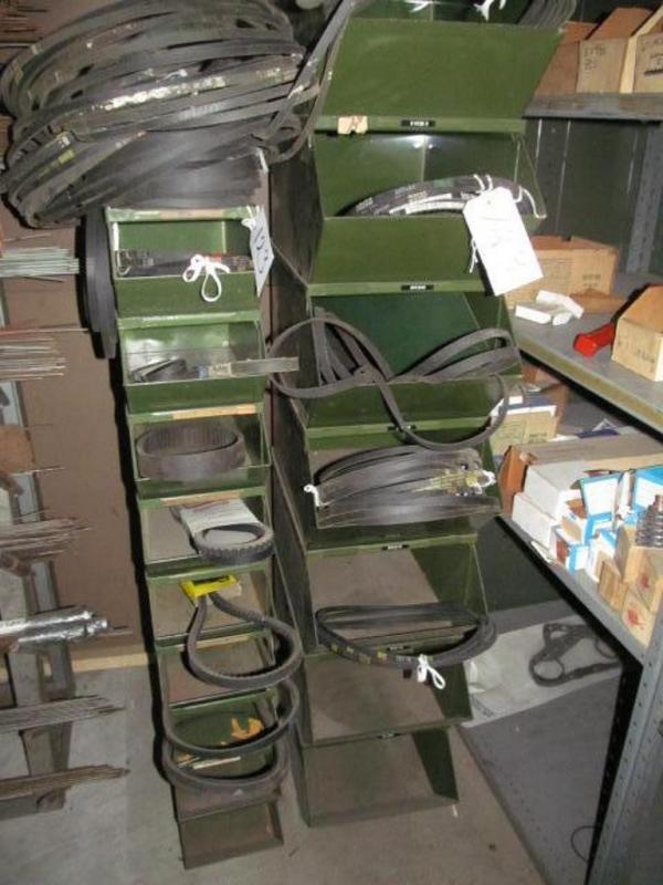 Seven stackable large bins and nine stackable small bins with contents; power transmission belt