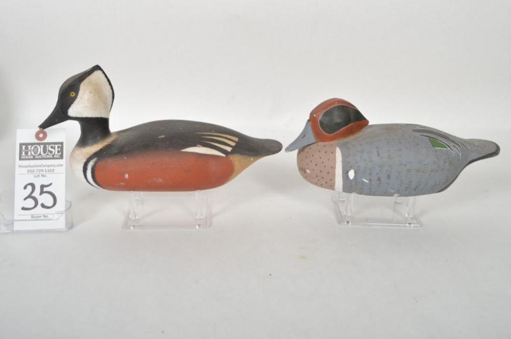 Dan Robinson, Hooded Merganser Drake, dated 1988, Signed by the maker. Tip end of tail is broken. Plus, Green Wing Teal Drake by Scotty Robinson, Ocra