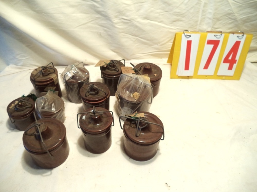 11 small crocks with lids image