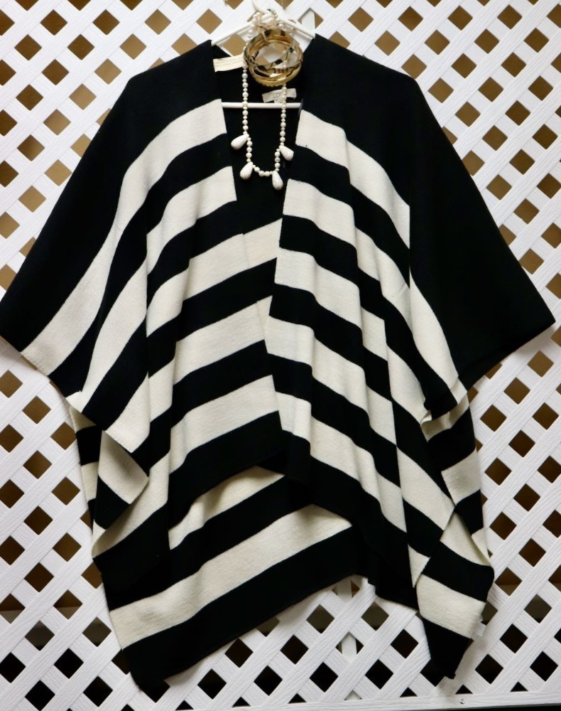 IT'S IMPOSSIBLE TO BE UNHAPPY WEARING A PONCHO