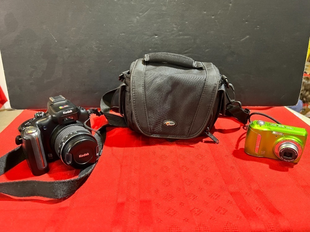 KODAK EASYSHARE P880 DIGITAL CAMERA, KODAK EASYSHARE C143 DIGITAL CAMERA, AND ONE CAMERA BAG. WORKING CONDITION UNKNOWN. SEE PICTURES FOR DETAILS. C43, C42, C49