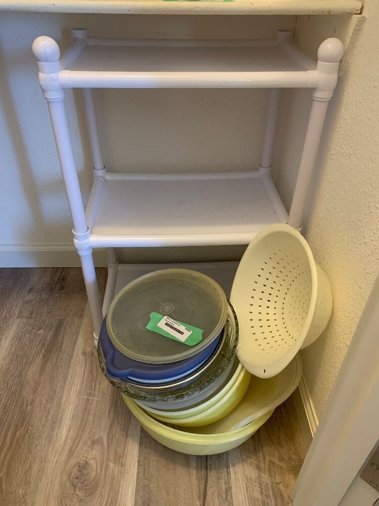 Plastic shelf, bowls and storage containers image