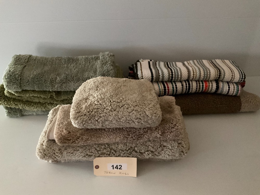Twelve Throw Rugs