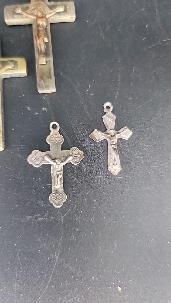 Crucifixion crosses: brass and other metals. All pendants.