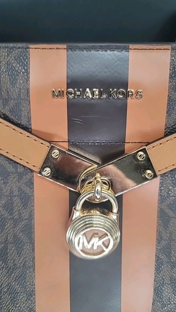 Michael Kors purse 9" X 9.5" X 3", long adjustable strap