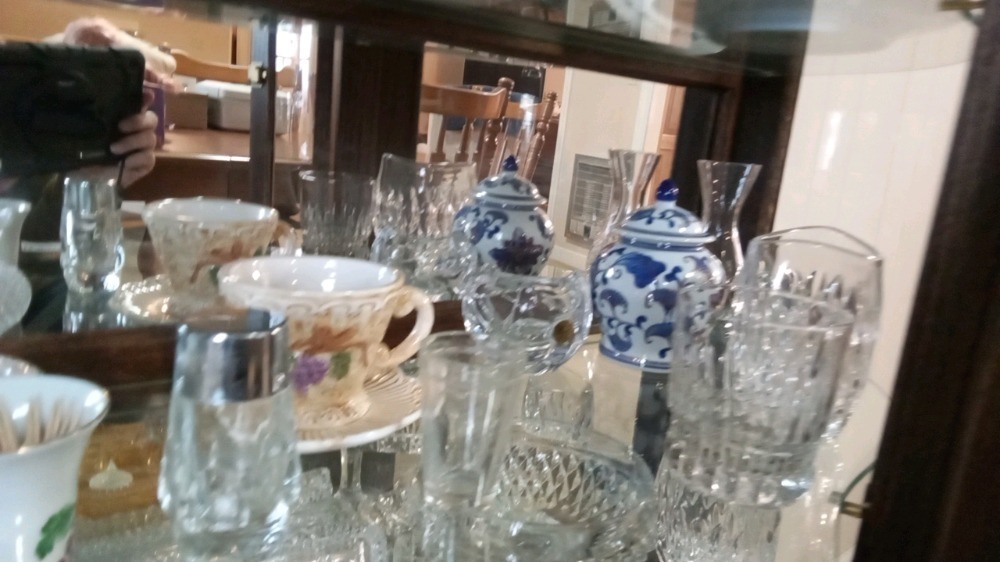 Contents of shelf in China cabinet