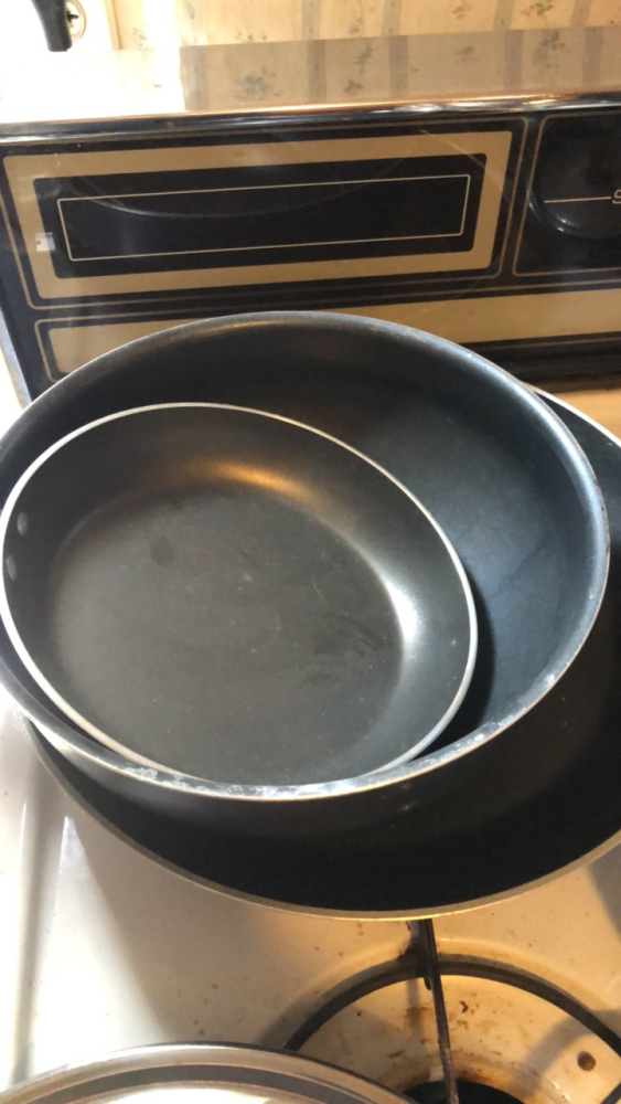Frying pans with vintage teapots
