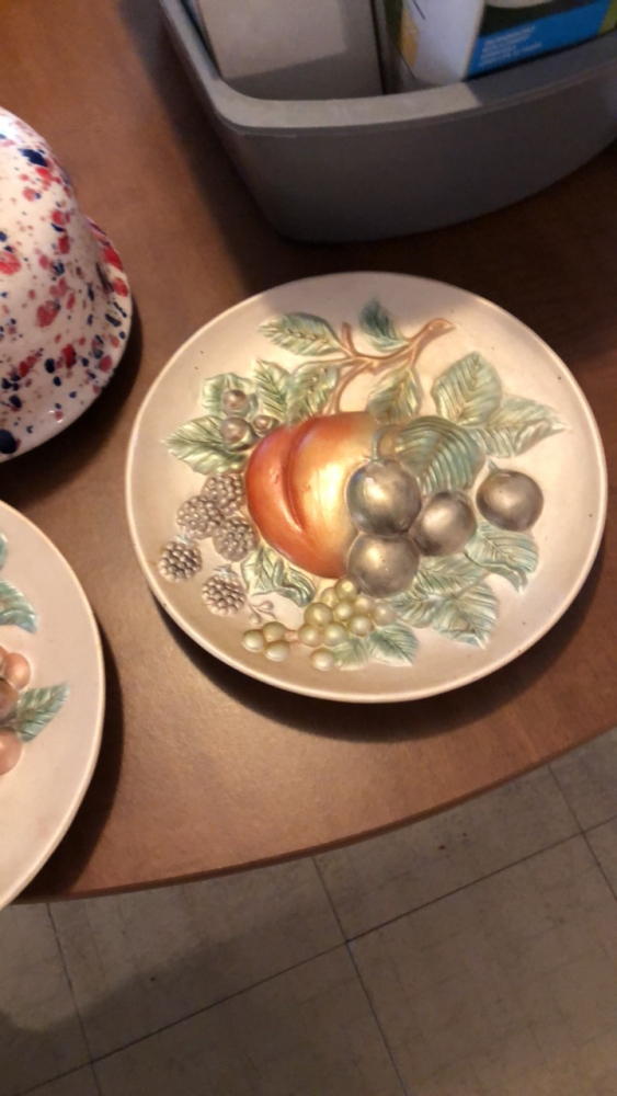 Vintage teapot with decorative plates
