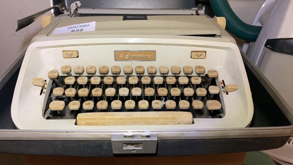 Montgomery Ward Signature 88 Portable Typewriter and Bissell Little Green cleaner