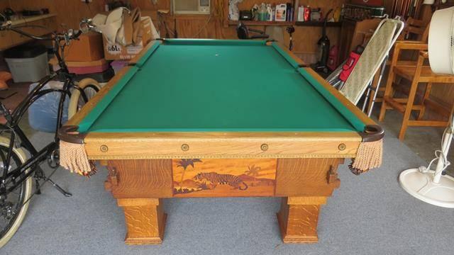 The K.C.  Billiard Wildlife -RARE turn of the century -Completely Restored  Pool Table with scrimshaw engraving- 9' X 5 also INCLUDED IS A CUE RACK AND BALL RACK'- PLEASE SCHEDULE PICK-UP FOR THIS ITEM !