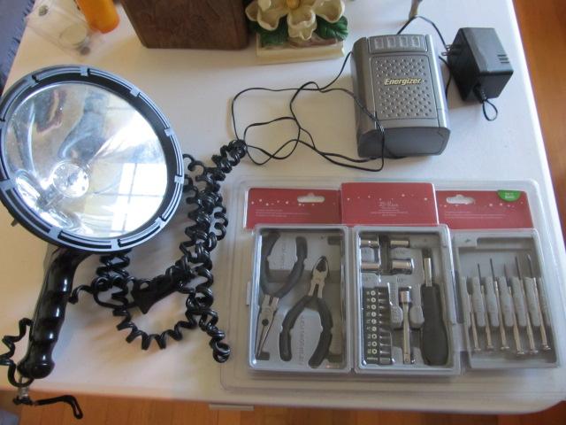 Spotlight, battery charger, tool kit