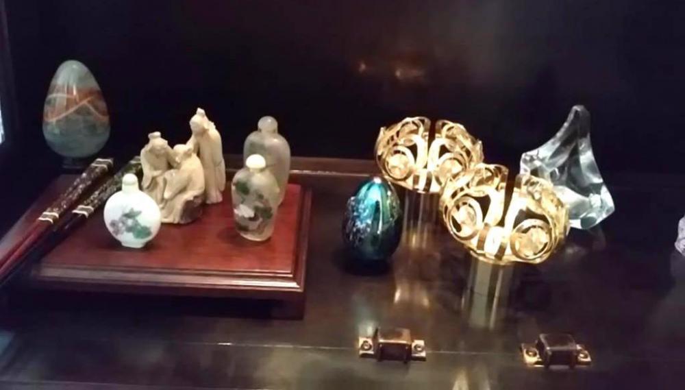 Contents of bottom shelf of cabinet