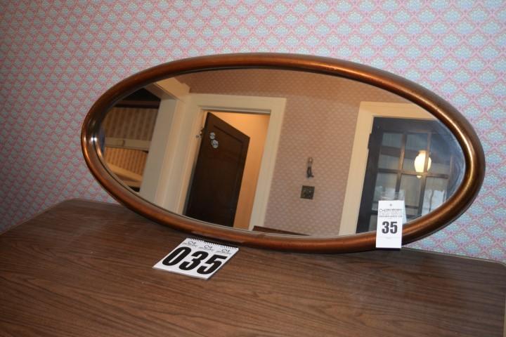 Oval shaped mirror