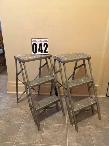2 metal step ladders