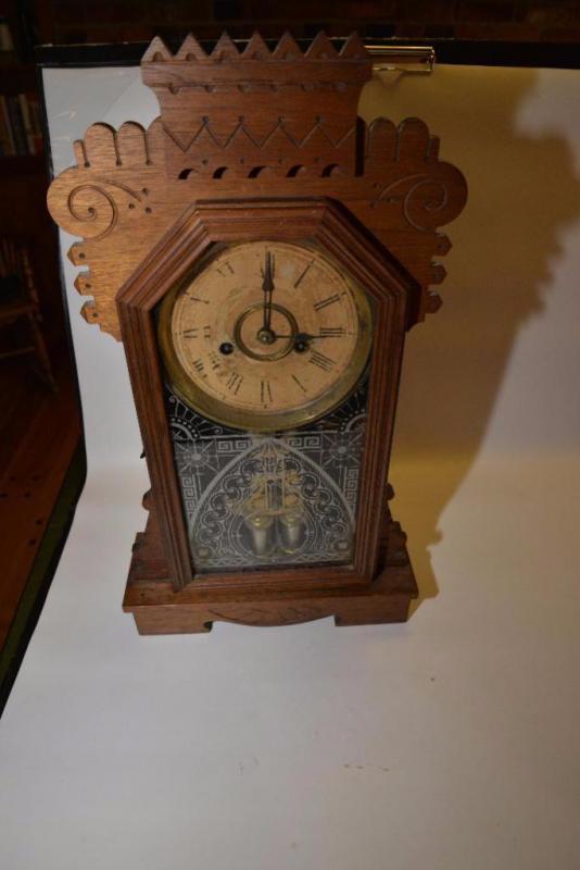 ANSONIA KITCHEN KITCHEN CLOCK WITH OAK CASE DESIGN DOOR- CARVED CREST- HT DAMAGE AND WEAR image