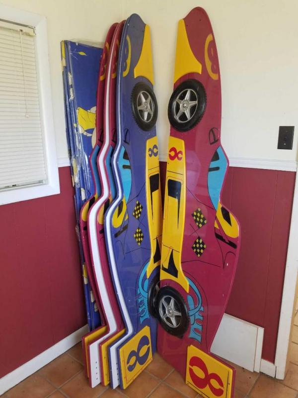 3 twin size race car beds-Assembly required; 2 red and 1 blue