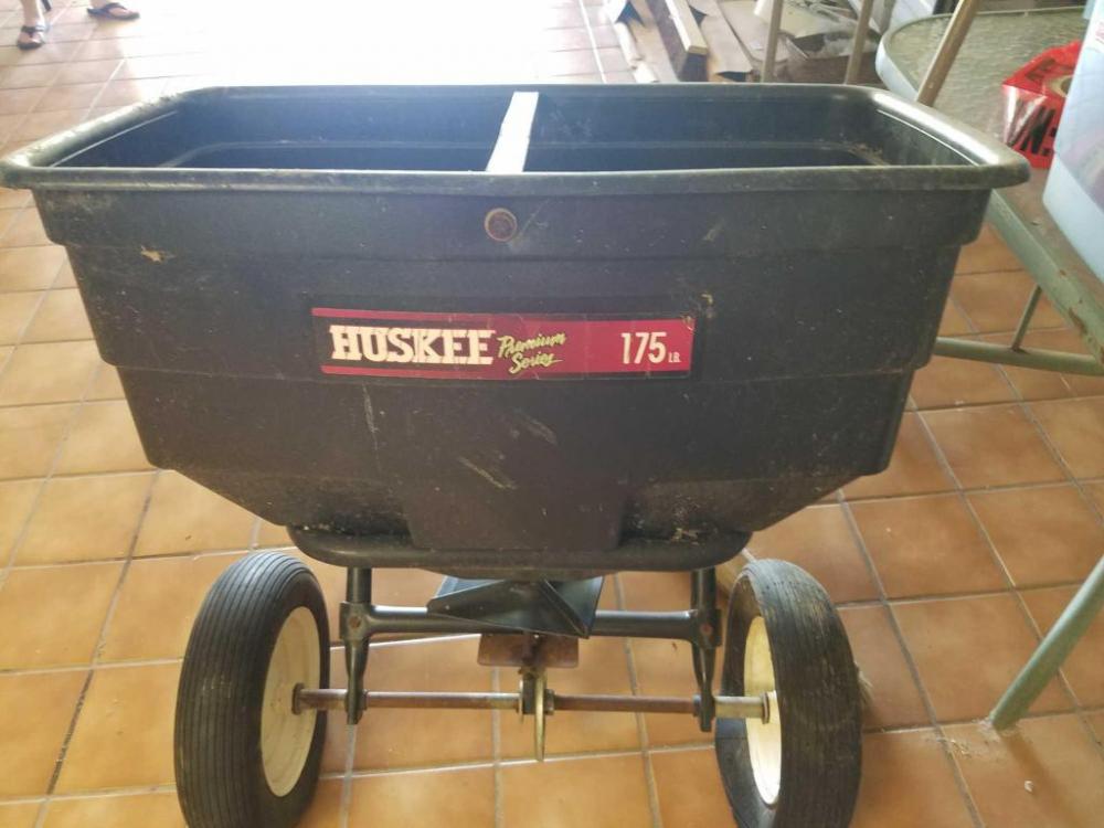 Huskee spreader- 175 lbs.; tires need to be replaced