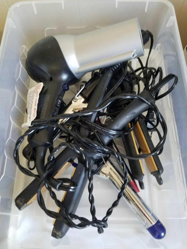 Assortment of hair tools- curling irons, blow dryer, flat iron (working order not known)