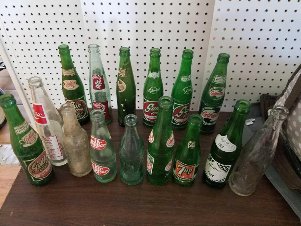 Assortment of 15 glass soda bottles
