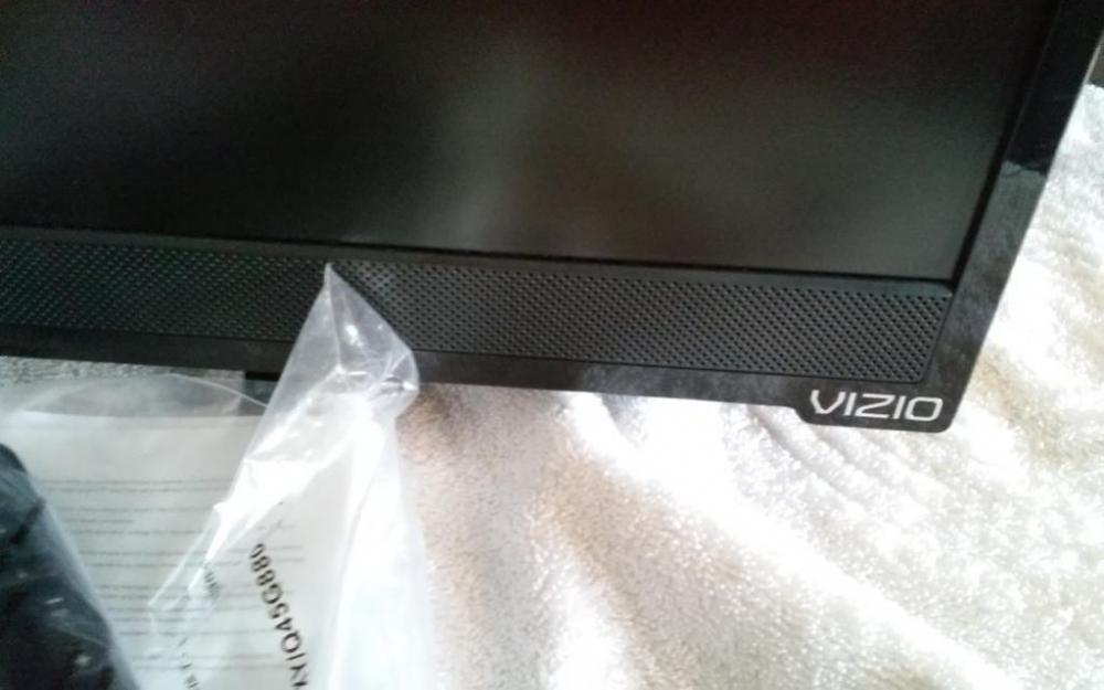 VIZIO flat screen TV with remote, approx. 25" diagonal