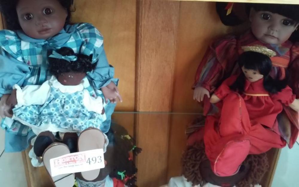 Set of 2 Porcelain Dolls, Each holding a baby doll.