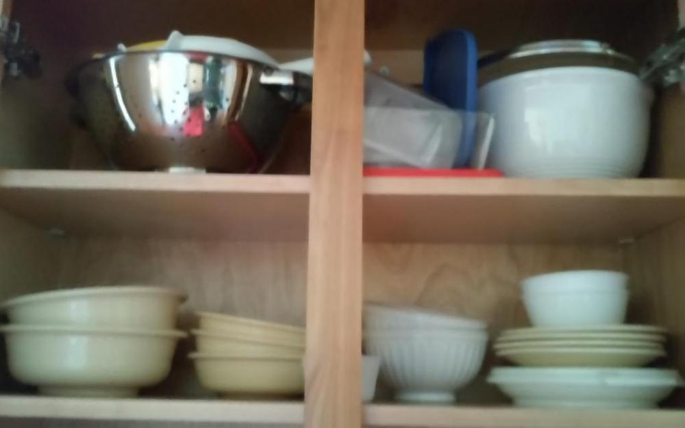Co tents of cabinet: plates, bowls, colanders, etc