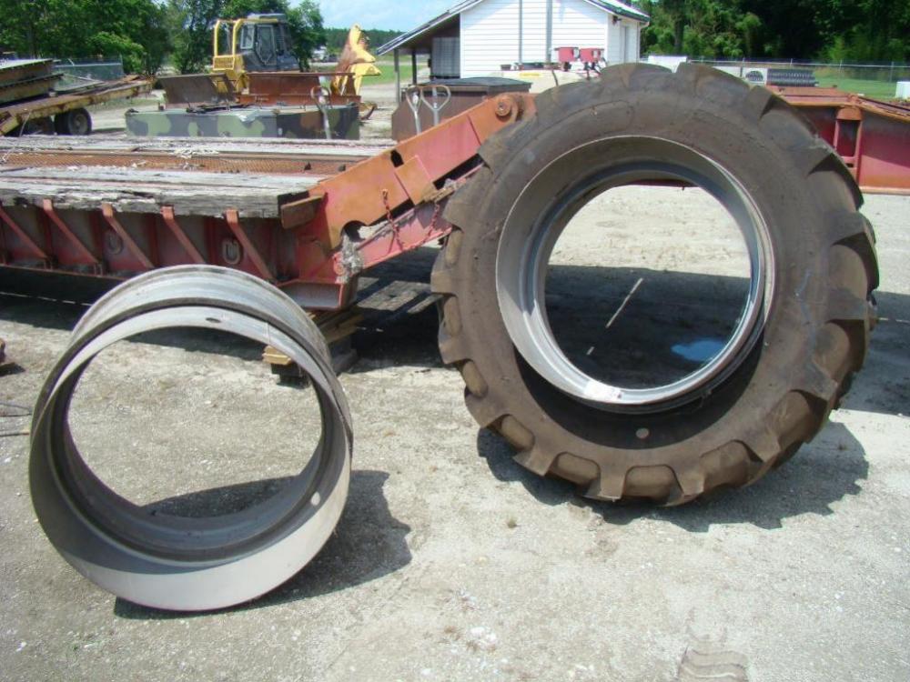 Two (2) MASSEY FERGUSON Dual Tractor Rims & One (1) Like New Tractor Tire. Rims - 16 x 38 - 10 T-RAIL DUAL w/ 10" Band; Tractor Tire - size 18.4 - 38